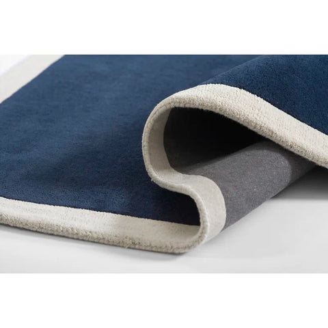 navy blue solid hand tufted rug