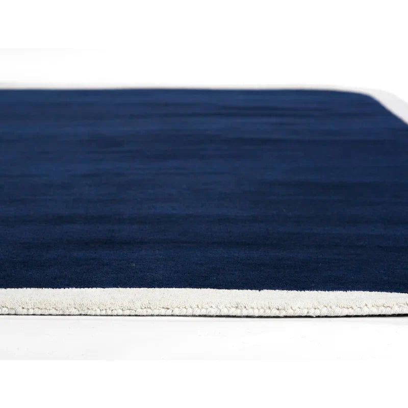 Pile thickness of Hand-tufted navy blue wool area rug with cream border – modern rectangular carpet for living room or bedroom