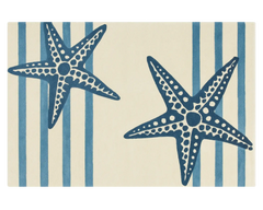 Hand-tufted navy starfish area rug on ivory background