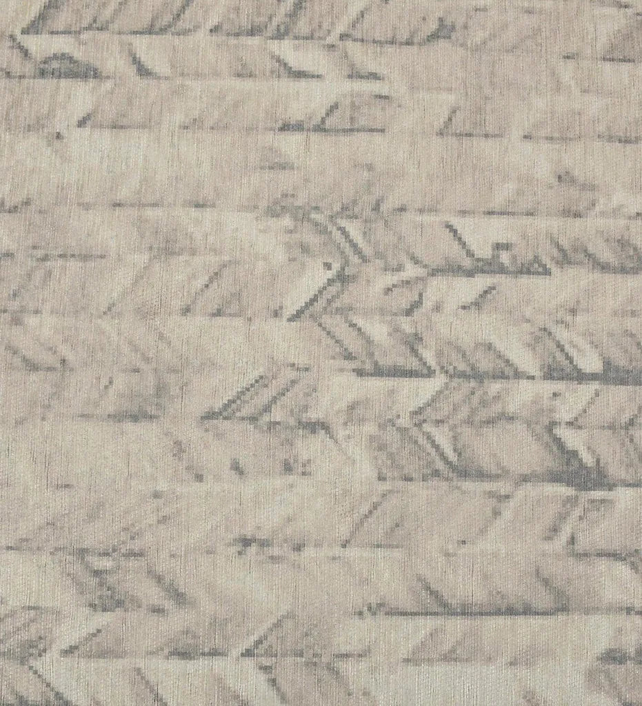 Soft neutral chevron rug for modern interiors.