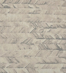 Soft neutral chevron rug for modern interiors.