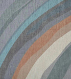 Abstract handwoven rug with earth tone waves in beige, rust, blue, and gray from Mannat Rugs