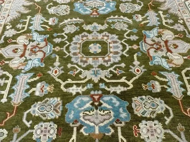 Luxury Persian design rug in green, gold, and beige tones
