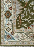 Close-up of olive green Persian style hand-knotted wool rug with floral and geometric border patterns