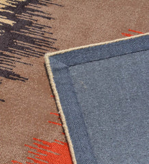 Handcrafted wool rug with abstract orange and brown design