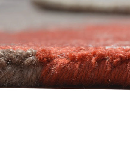 Contemporary abstract rug in beige, brown, and orange accents
