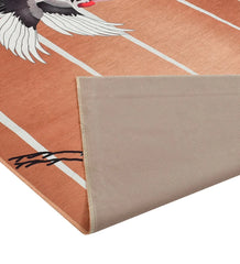 Durable bird patterned rug for cottage-style interiors.
