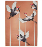 Peach-colored luxury rug with handwoven flying cranes design and tall white reeds