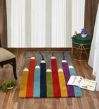 Colorful hand-tufted wool carpet with pencil design on wooden floor in cozy room
