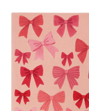 Hand-tufted pink holiday rug with sculpted bow details