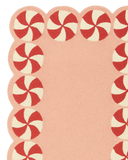 Festive peppermint-border rug in pink for holiday décor.