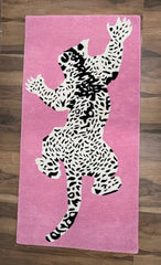 Bold animal print wool rug with leopard motif.