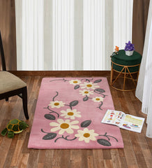 Playful pink rug featuring daisy flowers and green leaves