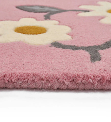 Modern pink wool rug with floral motif for bedroom decor