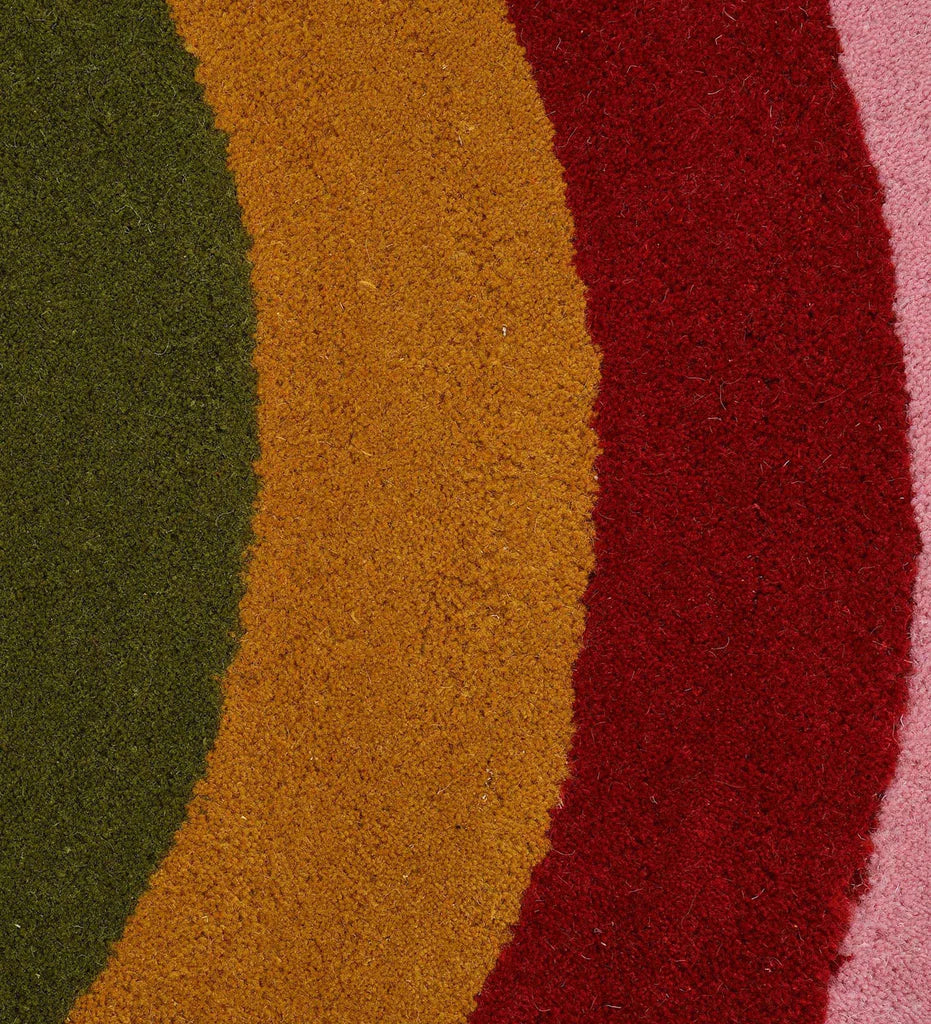 Luxury solid pink wool rug with subtle border detail