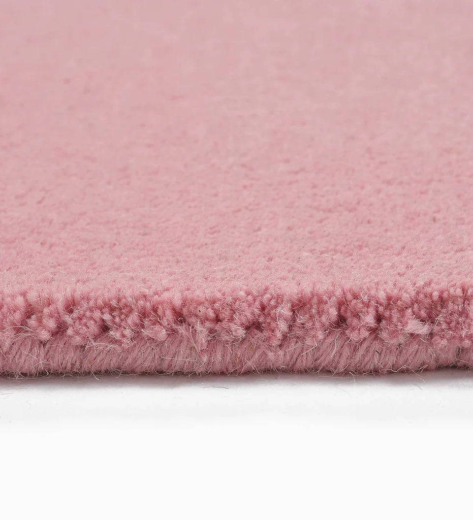 Soft pink hand-tufted rug for nursery or bedroom decor