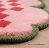 Pink checkerboard scallop wool rug