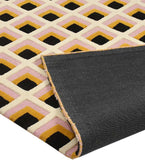 Handcrafted geometric rug with black, pink, and mustard color blocks