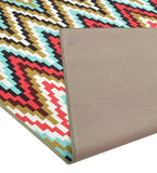 Luxury pixelated chevron rug in red, turquoise, gold, brown, and white with textured beige backing