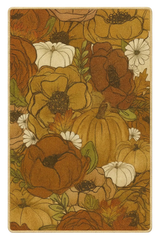 Pumpkin and floral autumn harvest rug in warm rust and gold tones.