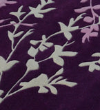 Purple rug with white and light pink botanical floral vine pattern