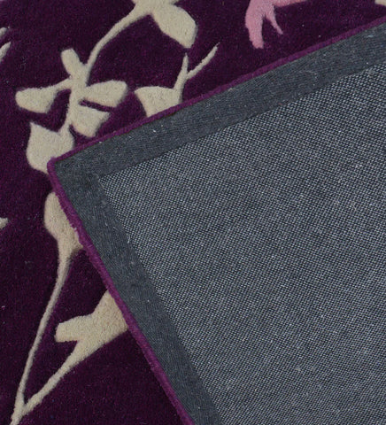 Hand-tufted contemporary rug in purple with pastel accents