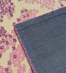 Contemporary purple hand-tufted rug with cream accents