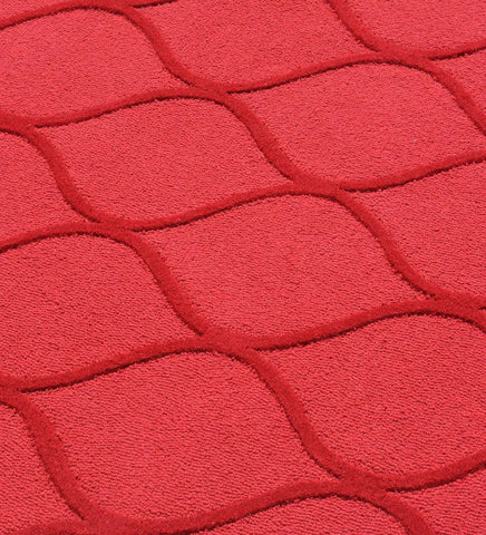 Luxury wool rug in solid red with raised geometric details