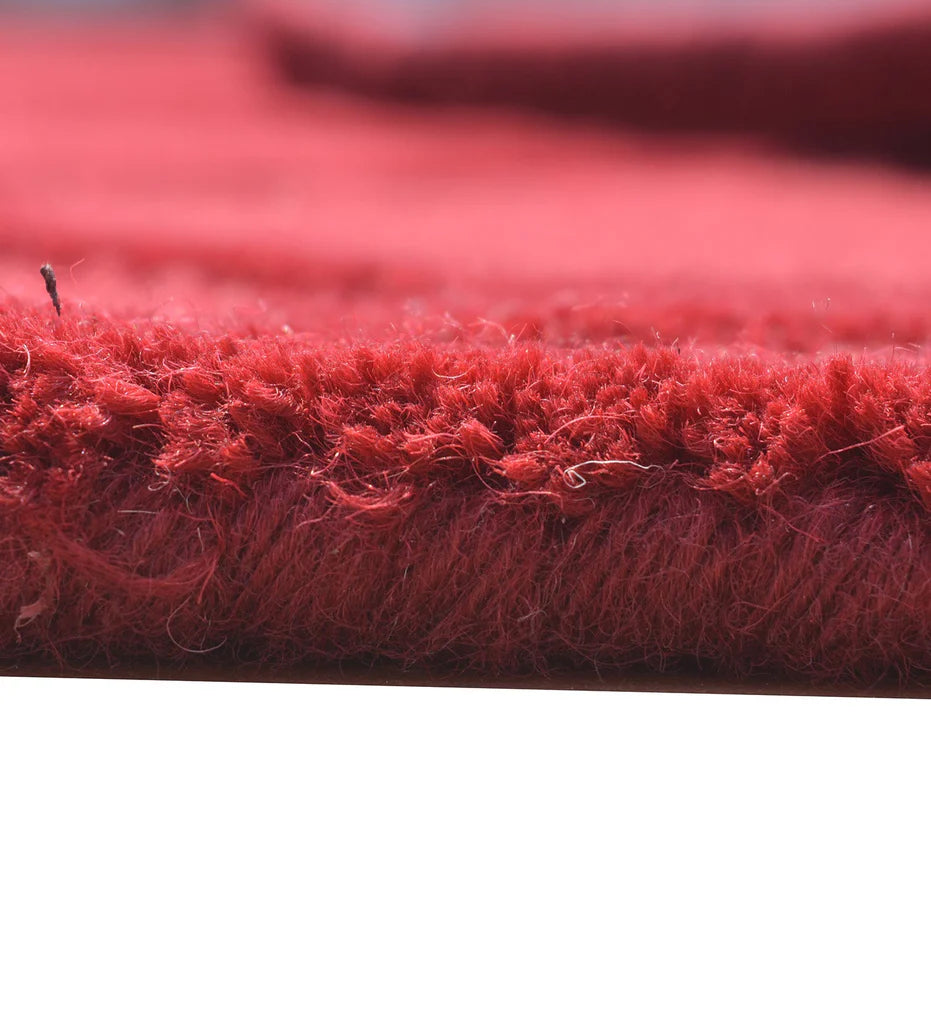 Contemporary red rug with bold geometric embossed texture