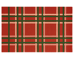 Premium wool holiday rug featuring festive plaid design.