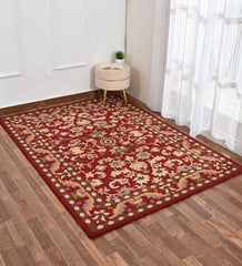 Classic red rug featuring floral and vine patterns in beige and green