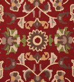 Luxury wool rug with traditional floral motif on deep red base