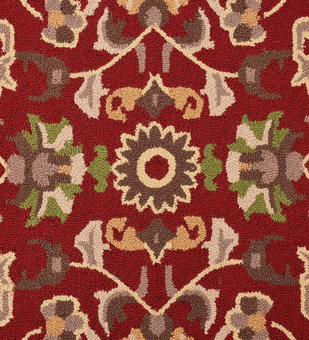 Luxury wool rug with traditional floral motif on deep red base