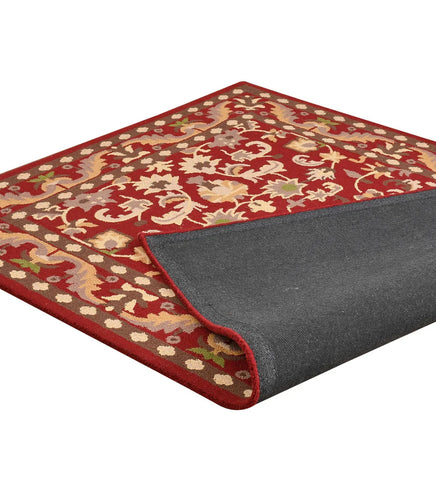 Handcrafted red and ivory floral rug with ornamental border design