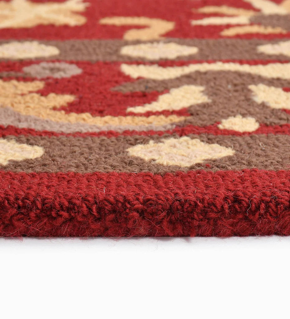 Elegant red wool rug with heritage-inspired floral detailing