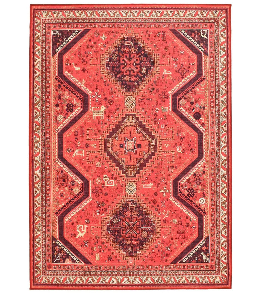 Red tribal rug with bold geometric motifs.