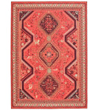 Red tribal rug with geometric patterns and intricate border detailing from Mannat Rugs