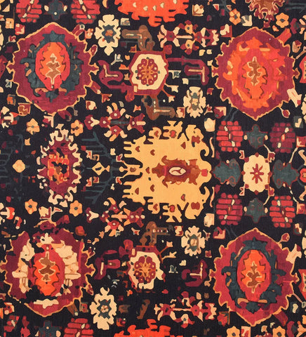 Low-profile red rug with cream and gold faded accents.