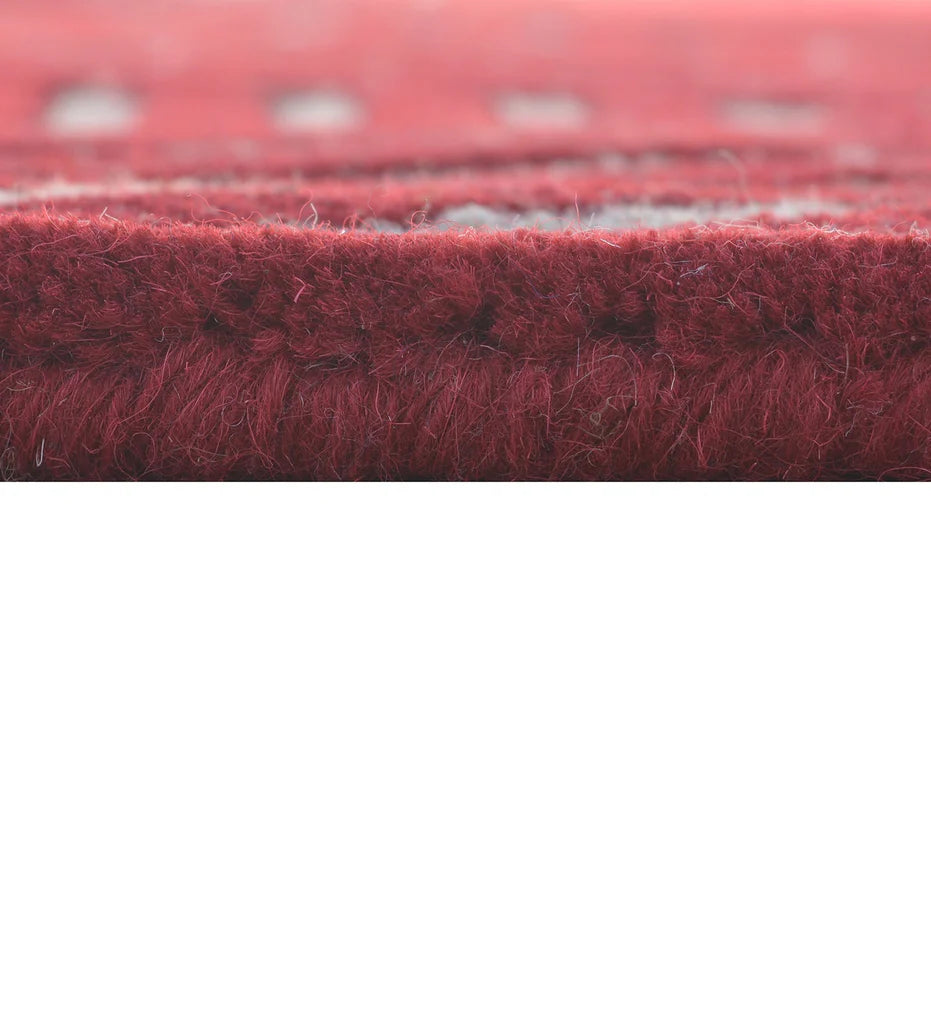 Hand-tufted wool rug with abstract linear pattern for modern interiors.