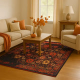 Living room with red vintage floral rug, beige sofa and armchair, wooden coffee table with vase and pumpkin