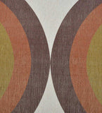 Handwoven luxury rug with retro geometric arches in brown, orange, olive green, and cream colors