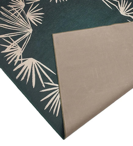 Bold and vibrant teal floor rug with easy-care design.