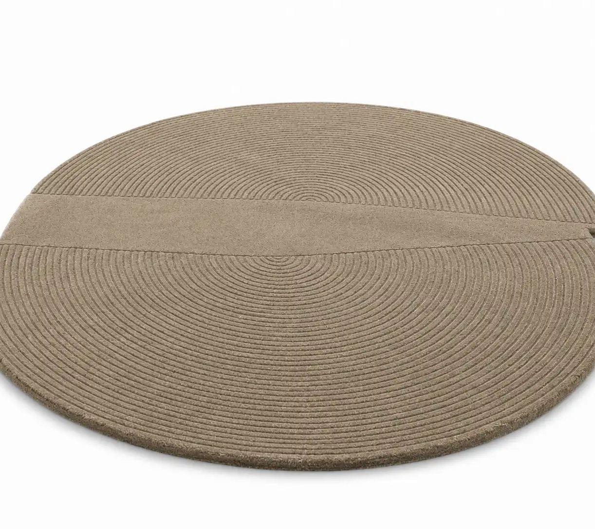 Round braided rug on a white background

