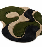 Rug with green, black, and beige abstract design on a white background

