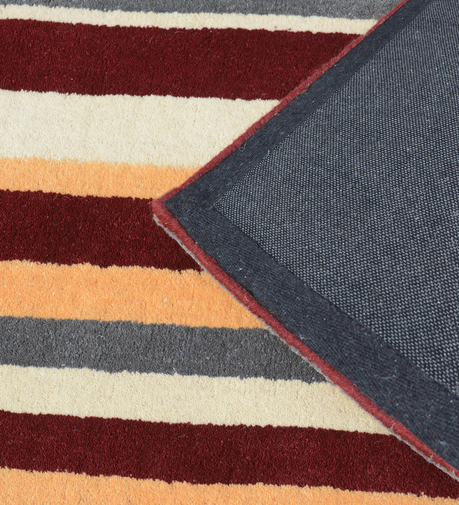 Handcrafted wool rug with multi-color striped design for living rooms.
