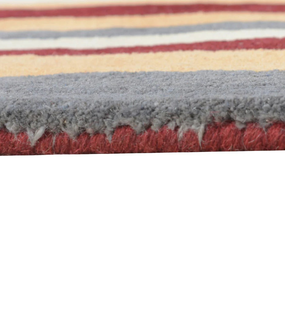 Contemporary hand-tufted wool rug in rust and grey vertical pattern.
