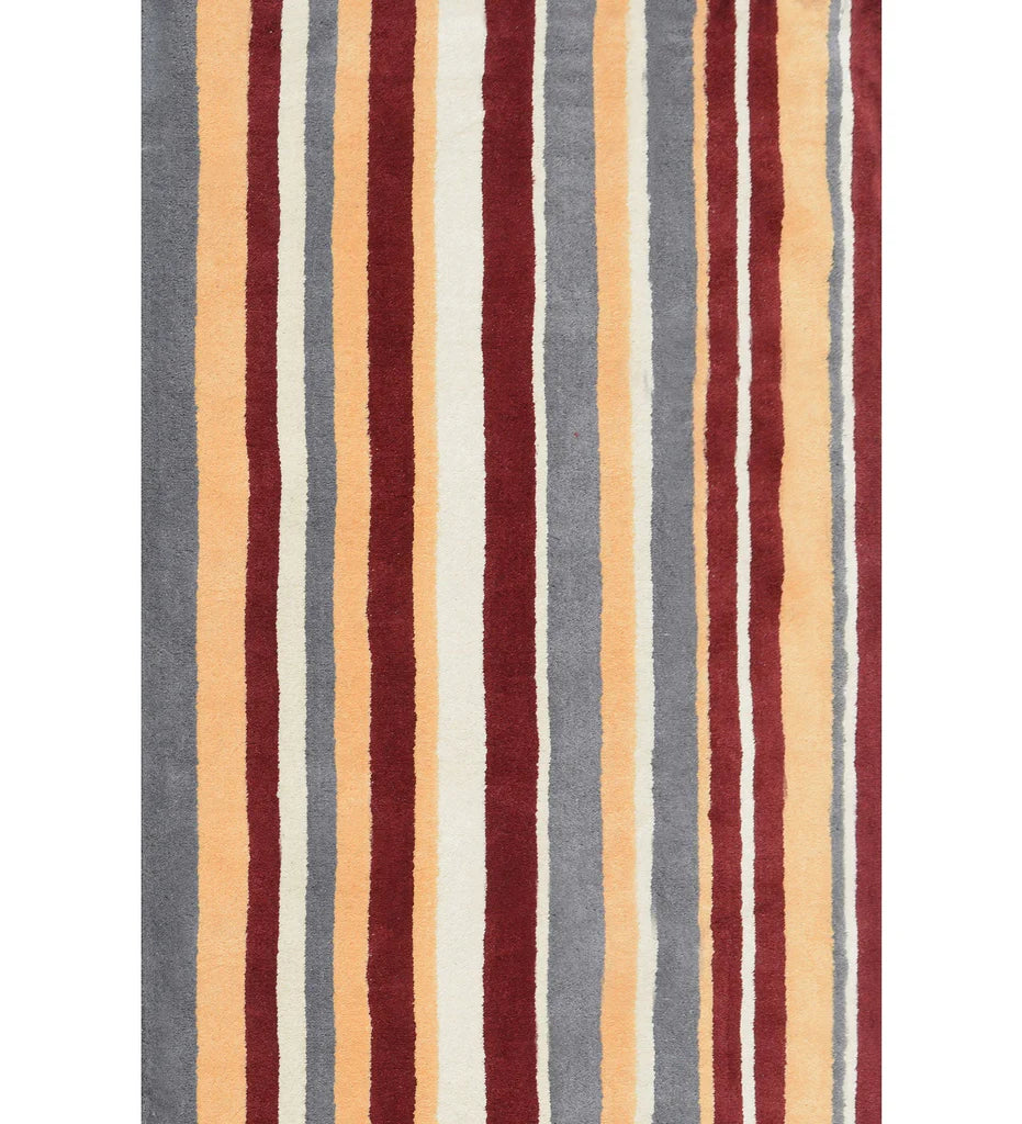 Rust red, mustard, and gray hand-tufted wool rug with modern vertical stripes.