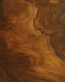 Machine washable autumn rug with woodgrain swirl pattern.