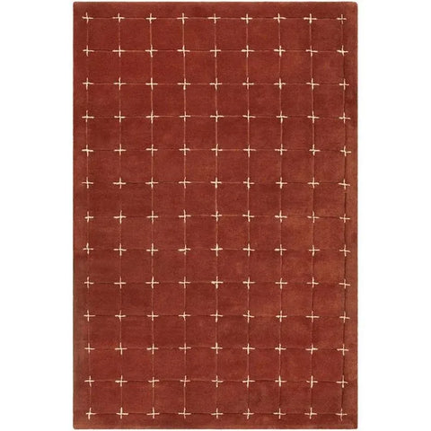 Hand-tufted rustic red wool rug with cream grid pattern.