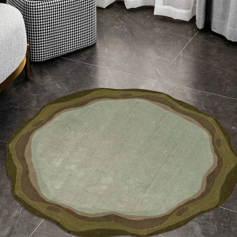 irregular round shaped sage green hand tufted rug